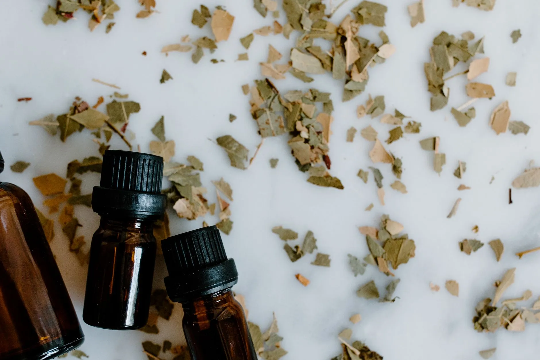 Soft, minimal bottles representing fragrance choices