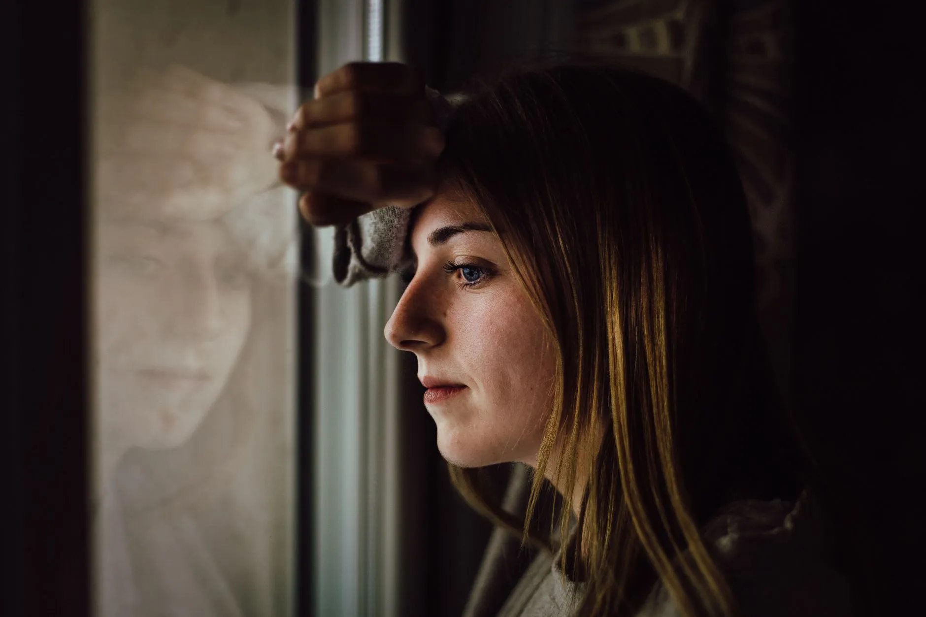 A thoughtful woman in soft natural light