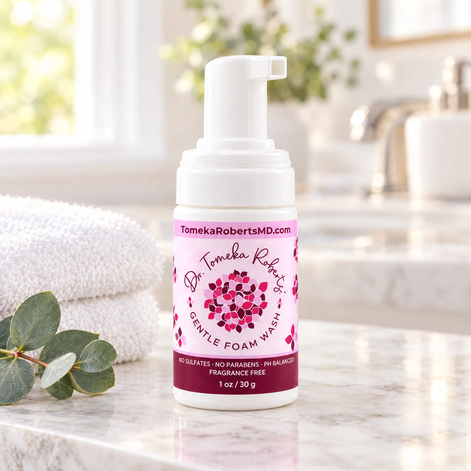 The 1 oz Fragrance-Free travel bottle on a marble bathroom counter beside a folded towel