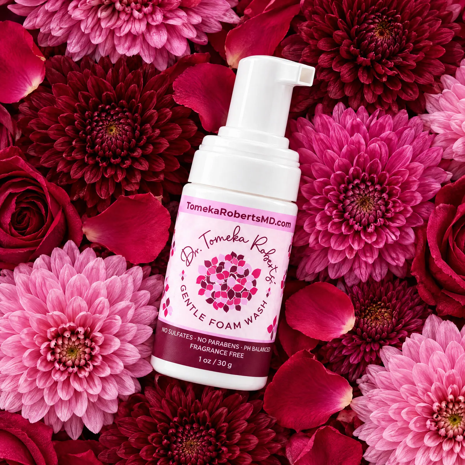 The 1 oz Fragrance-Free travel bottle on a bed of pink and crimson blooms
