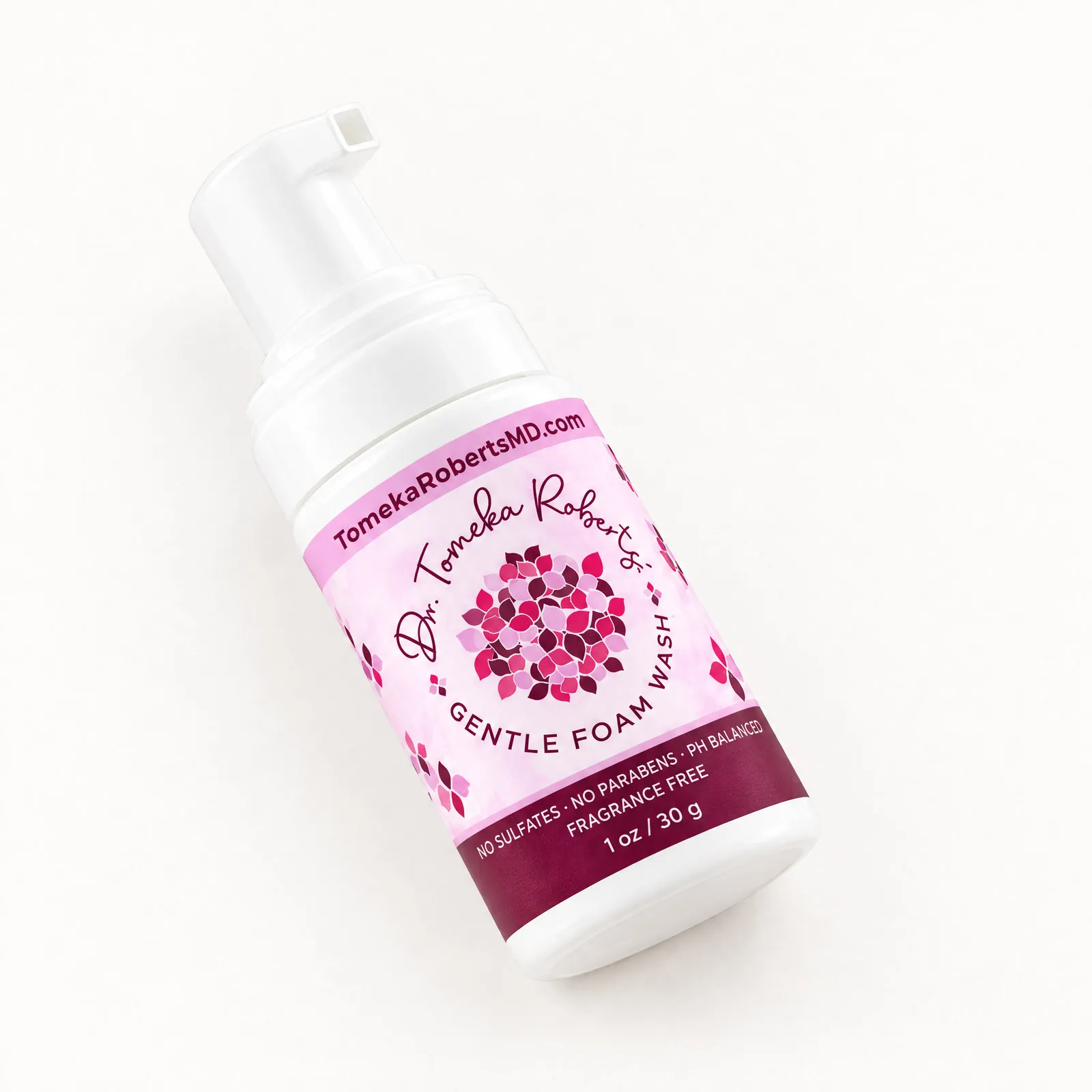 The 1 oz Fragrance-Free travel bottle lying on its side, label facing the camera