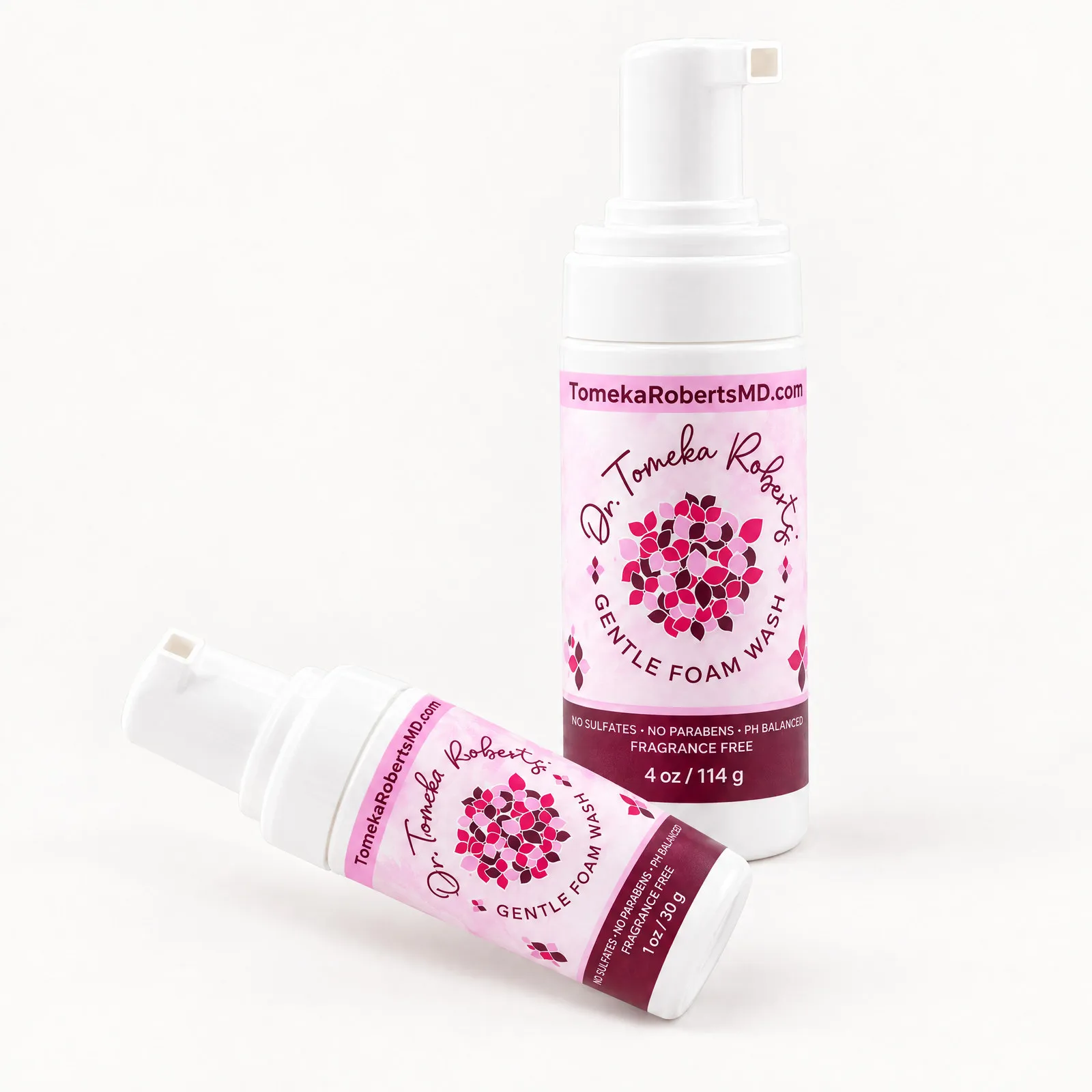 The 4 oz Fragrance-Free bottle standing with the 1 oz travel size lying in front of it