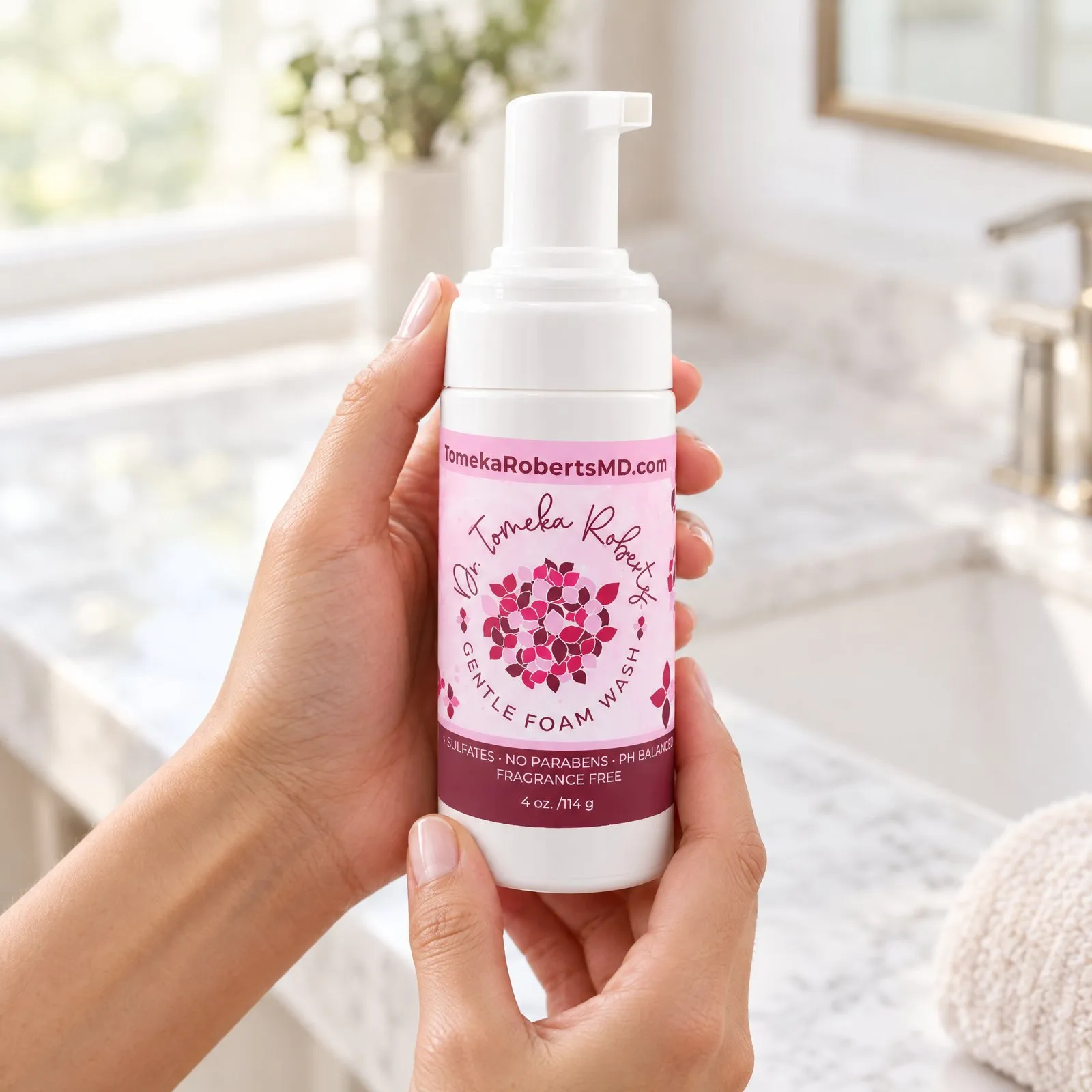 Hands holding the Fragrance-Free Gentle Foam Wash in a bright bathroom