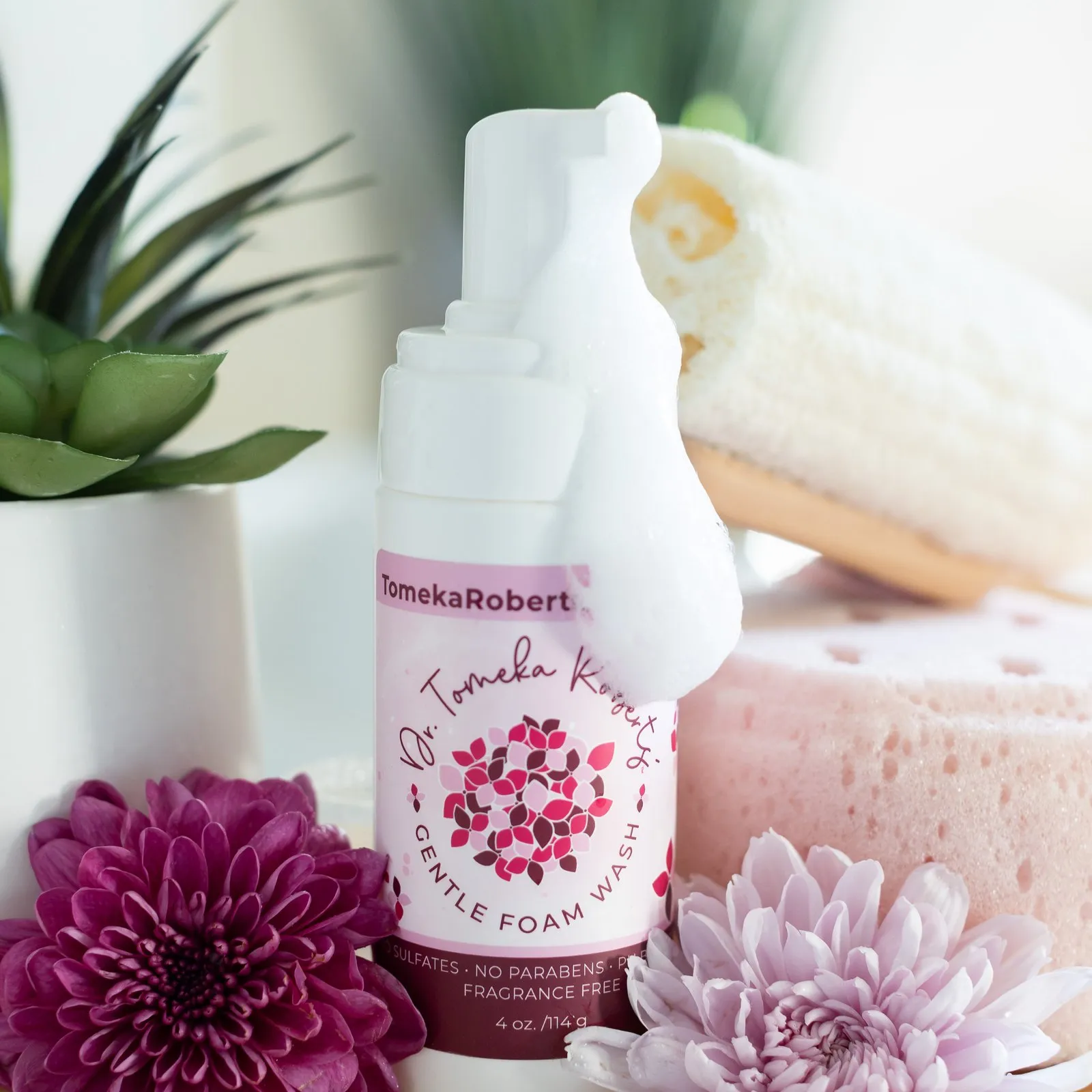 Fragrance-Free Gentle Foam Wash styled with foam, greenery and a rolled towel