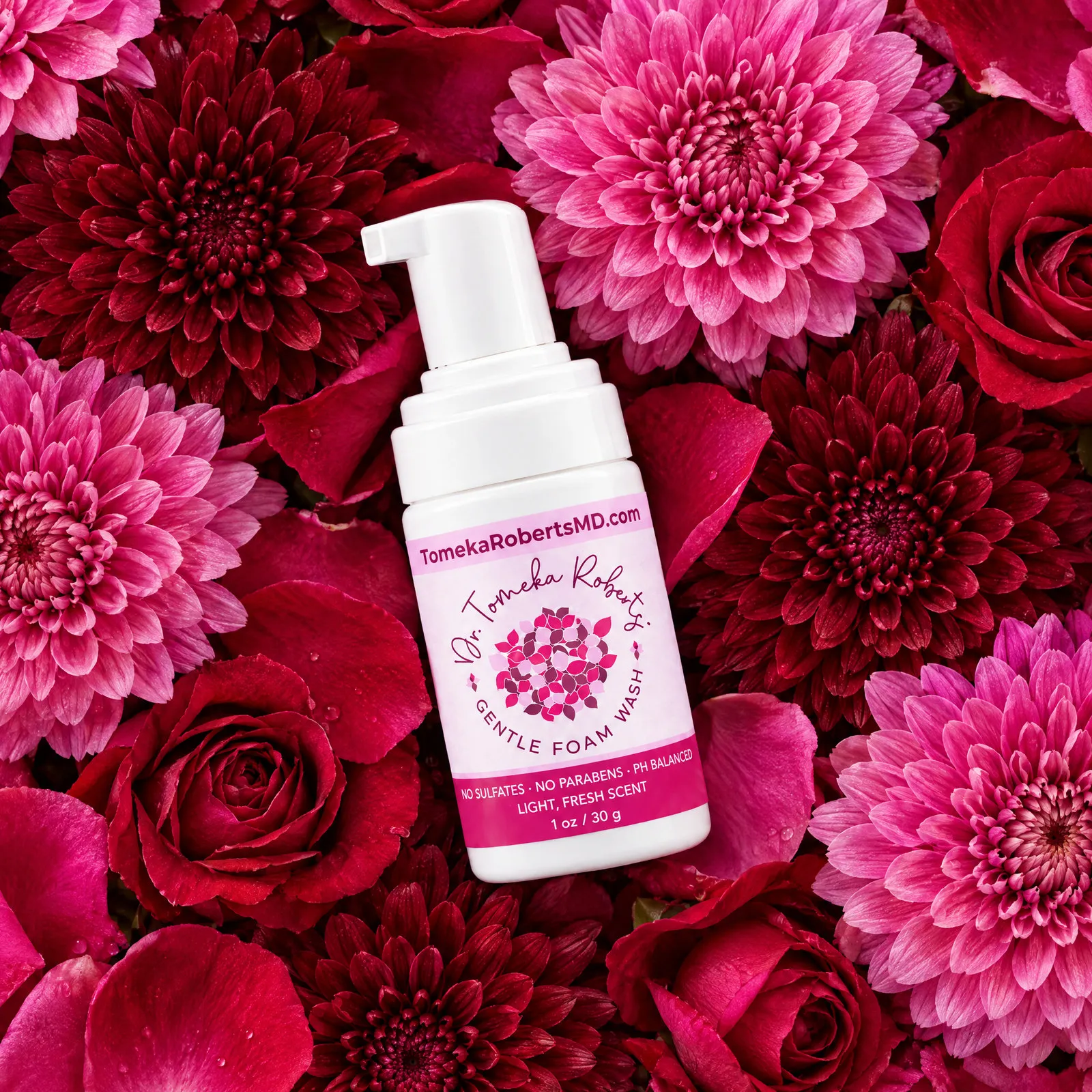The 1 oz Fresh Scent travel bottle on a bed of pink and crimson blooms