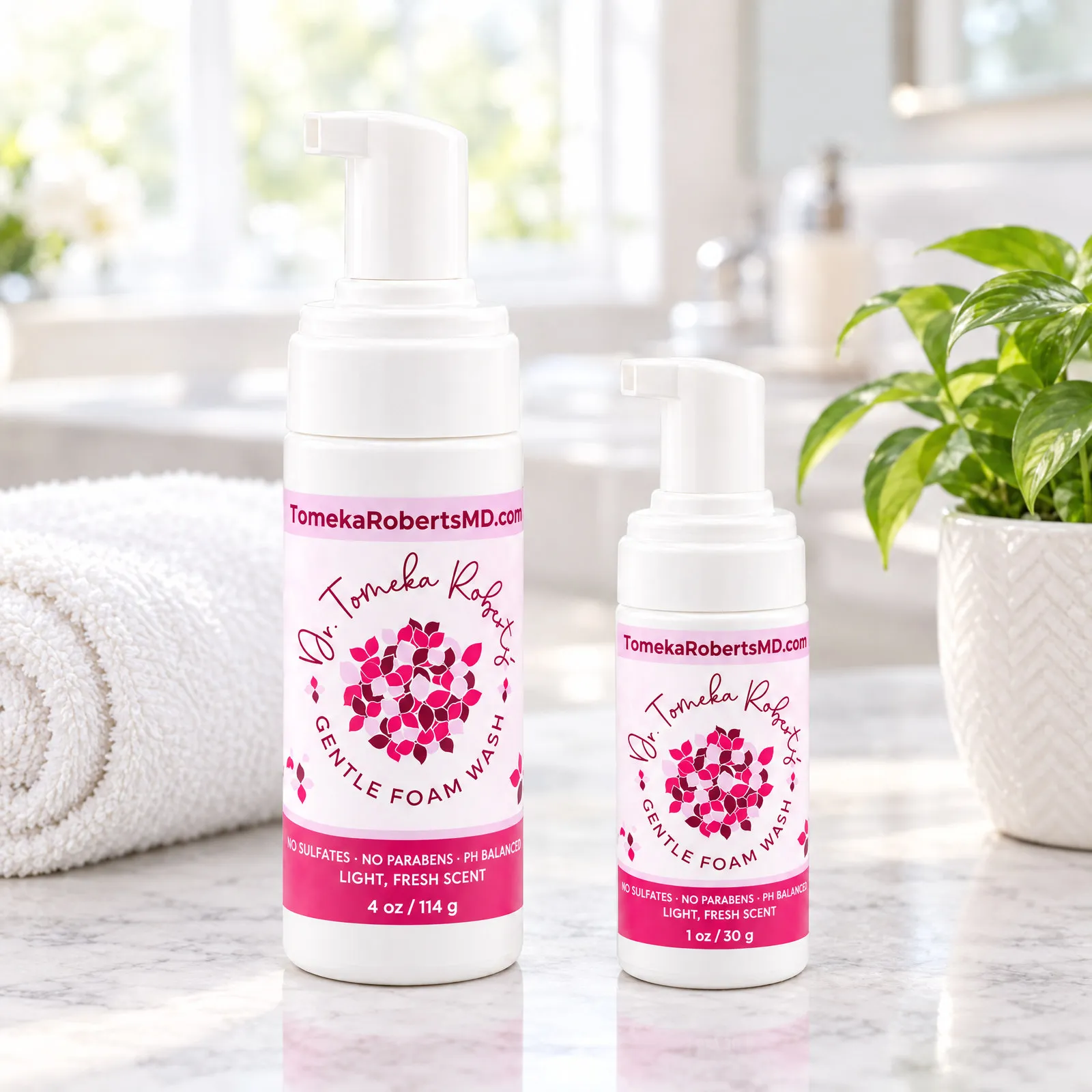 Both Fresh Scent sizes on a marble bathroom counter with a towel and a potted plant