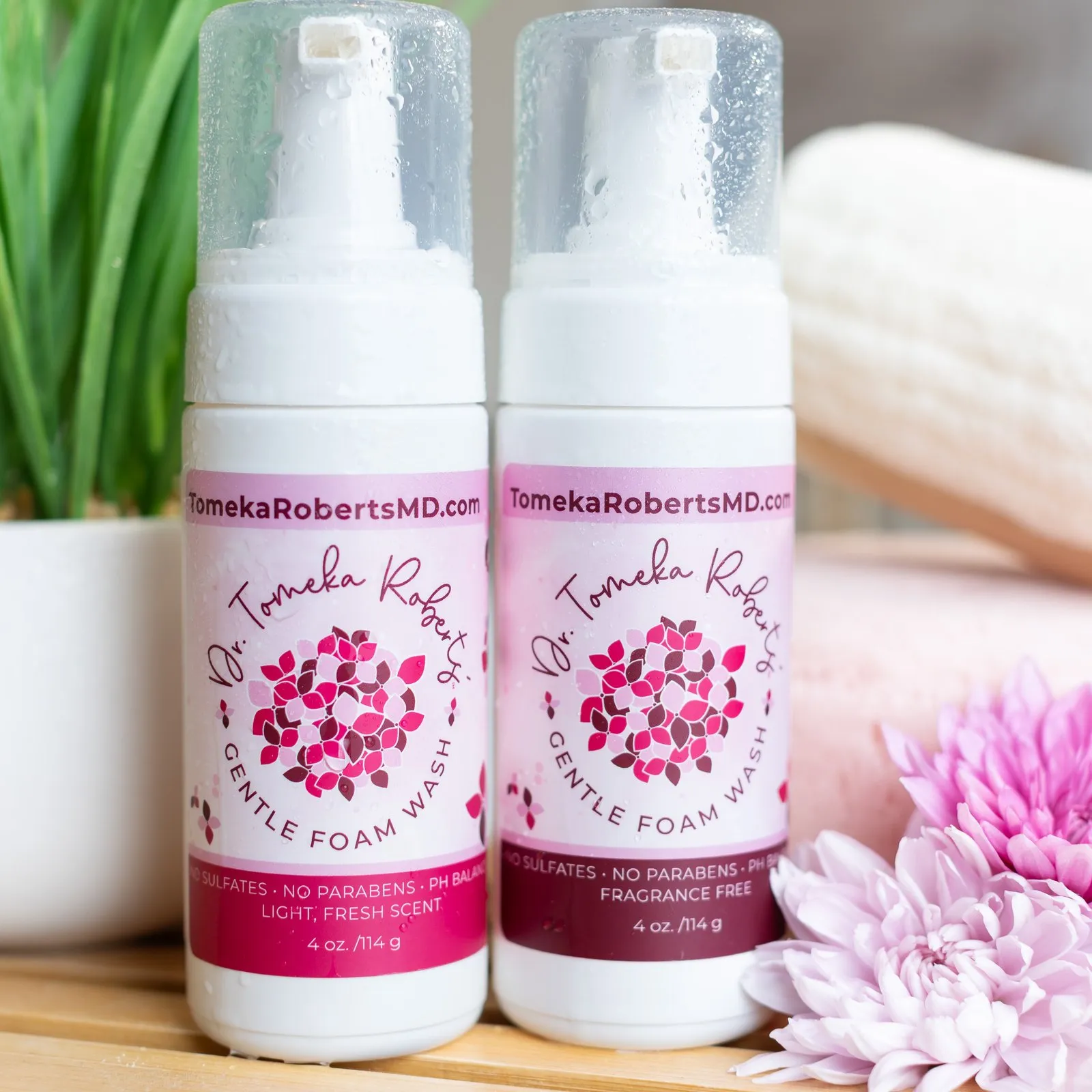 Dr. Roberts Feminine Wash and pH Perfect Bath Bomb on a bath caddy with folded towels